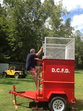 Chief D. Wagoner takes his thurn in the dunking booth at the reunion