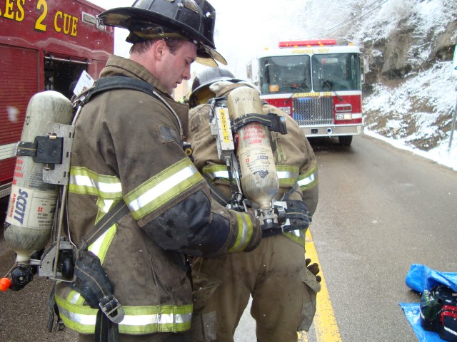 PHIL ASSISTING IN CHANGING CYLINDER