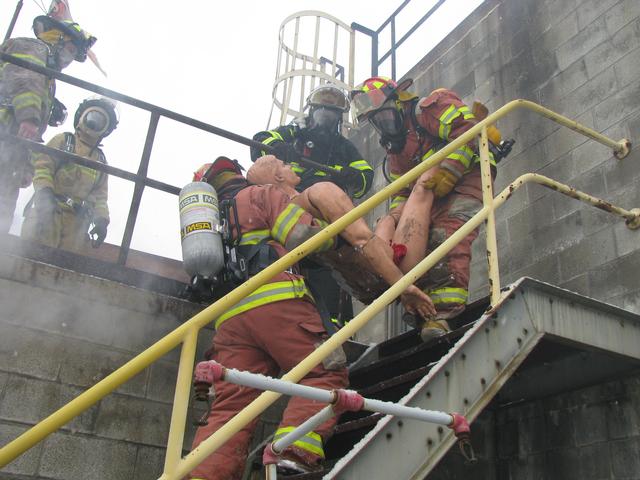 The victim is removed by two Clendenin VFD firefighters