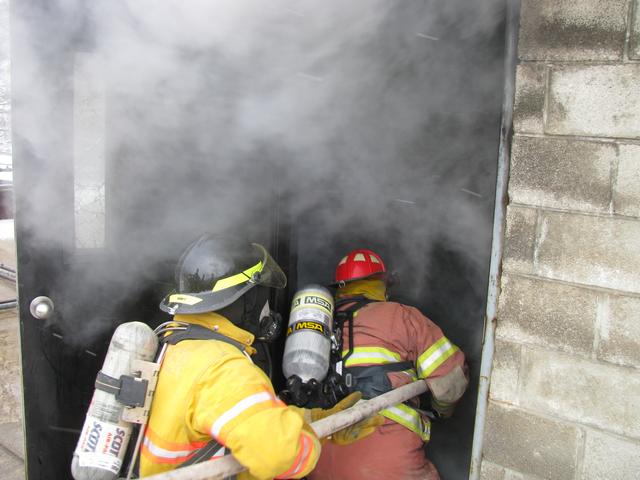 Firefighters from Clendenin & Big Otter make entry