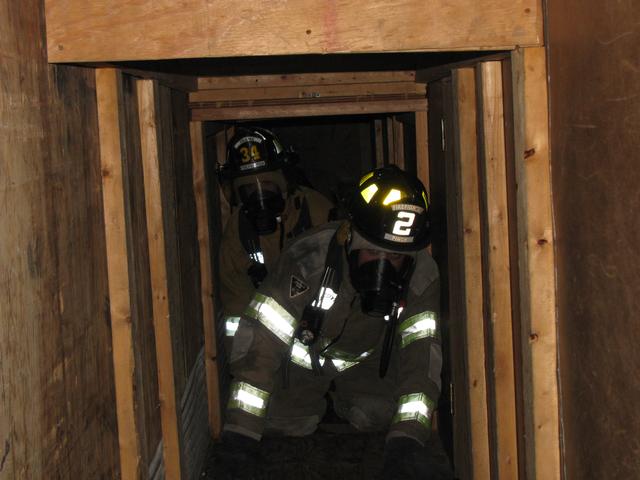 FF J. Coon & FF J. Russell (Frame VFD) navigate through the maze trailer